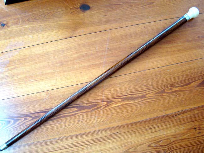 A 19th century rosewood walking stick with whale ivory knob and silver band engraved 'J.C. Rollins' circa 1860. — image 2